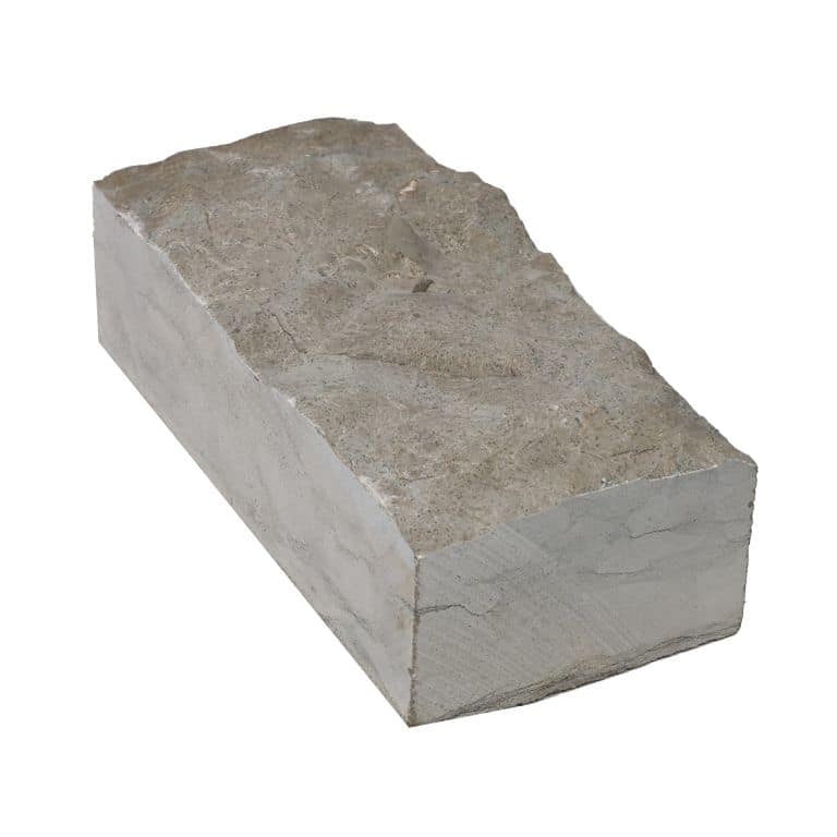 Oblique image for Blue Harbor Limestone Cobblestone - Rectangle - Splitface. The surface finish shown is split-face. The dominant color shown is gray.