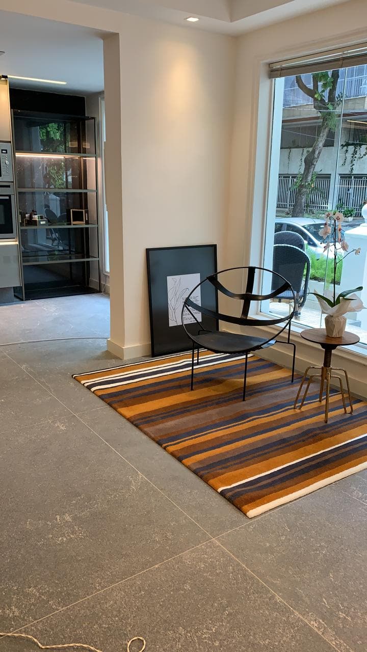 Application image for Strata Mist Cross-Cut Gneiss - Interior Flooring. The image shows this product being used in an interior floor application. The surface finish shown is honed. The dominant color shown is gray.