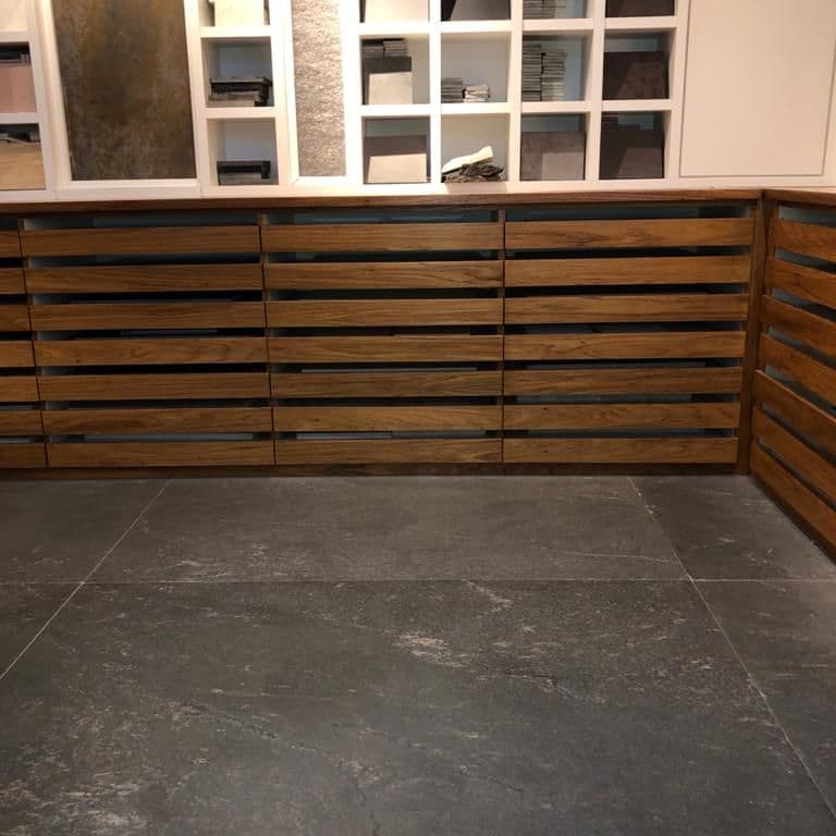 Application image for Strata Mist Cross-Cut Gneiss - Interior Flooring. The image shows this product being used in an interior floor application. The dominant color shown is gray. The color mix creates a cool feeling.