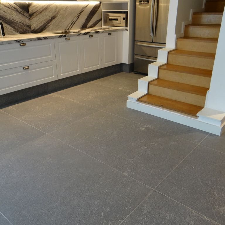 Application image for Strata Mist Cross-Cut Gneiss - Interior Flooring. The image shows this product being used in an interior floor application. The dominant color shown is gray. The color mix creates a cool feeling.