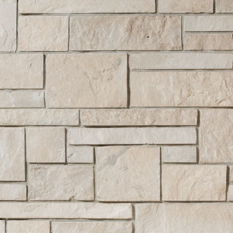 Color/Finish variation image for Lannon Pewter Limestone - Veneer. The surface finish shown is split-face. Dominant colors shown are beige and tan. The color mix creates a warm feeling.