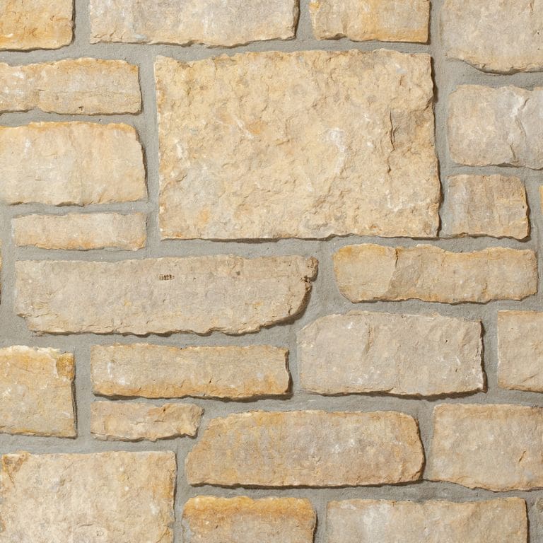 Application image for Golden Buff Limestone - Veneer. The image shows this product being used in a thin veneer application. The surface finish shown is . Dominant colors shown are beige, yellow and tan. The color mix creates a warm feeling.