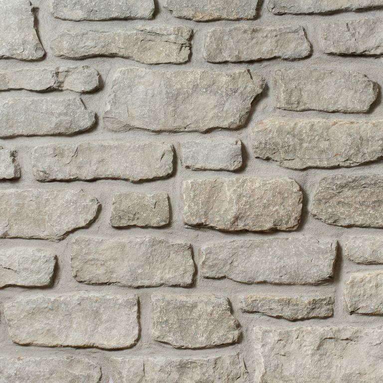 Application image for Madison Limestone - Veneer. The image shows this product being used in a thin veneer application. The surface finish shown is . The dominant color shown is gray. The color mix creates a warm feeling.