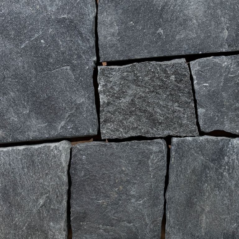 Color/Finish variation image for Raven Hill Granite - Thin Veneer. The surface finish shown is split-face. Dominant colors shown are black and gray; with blue, brown and green secondaries. The color mix creates a cool feeling. Streaked, fine speckled, speckled, blotched and random color patterns.