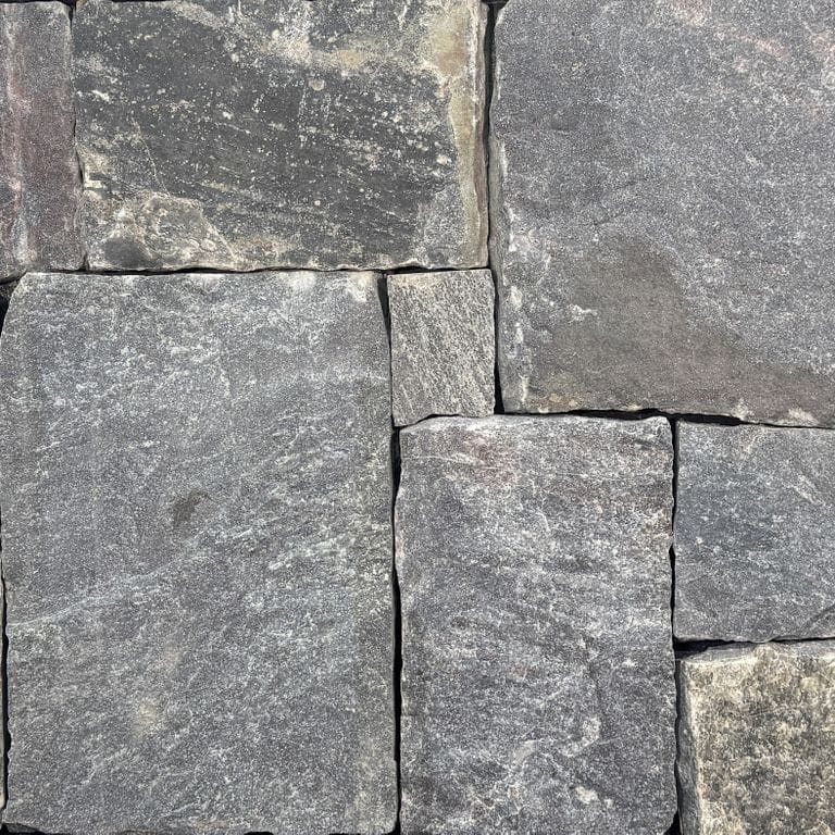 Color/Finish variation image for Lake Korynth Granite - Thin Veneer. The surface finish shown is split-face. The dominant color shown is gray.