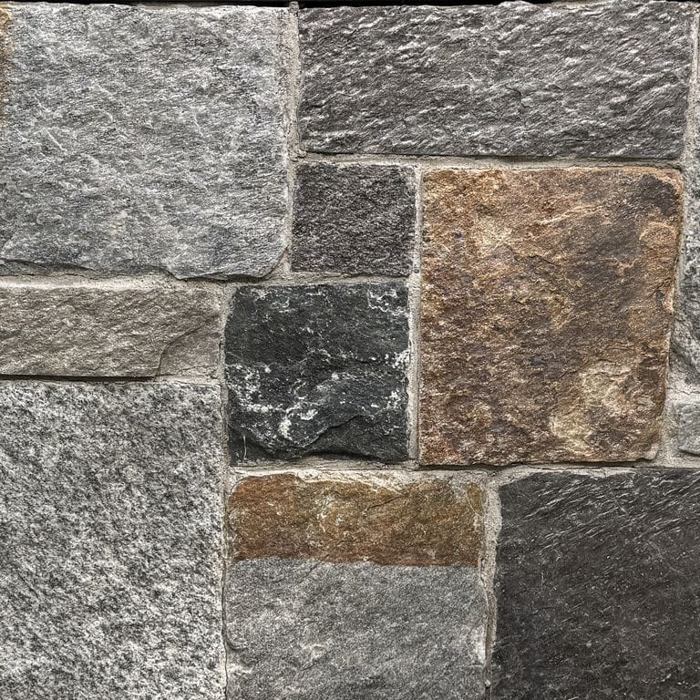Color/Finish variation image for Quincy Granite - Thin Veneer. The surface finish shown is split-face. Dominant colors shown are brown and gray. The color mix creates a warm feeling. Speckled, blotched and coarse speckled color patterns.