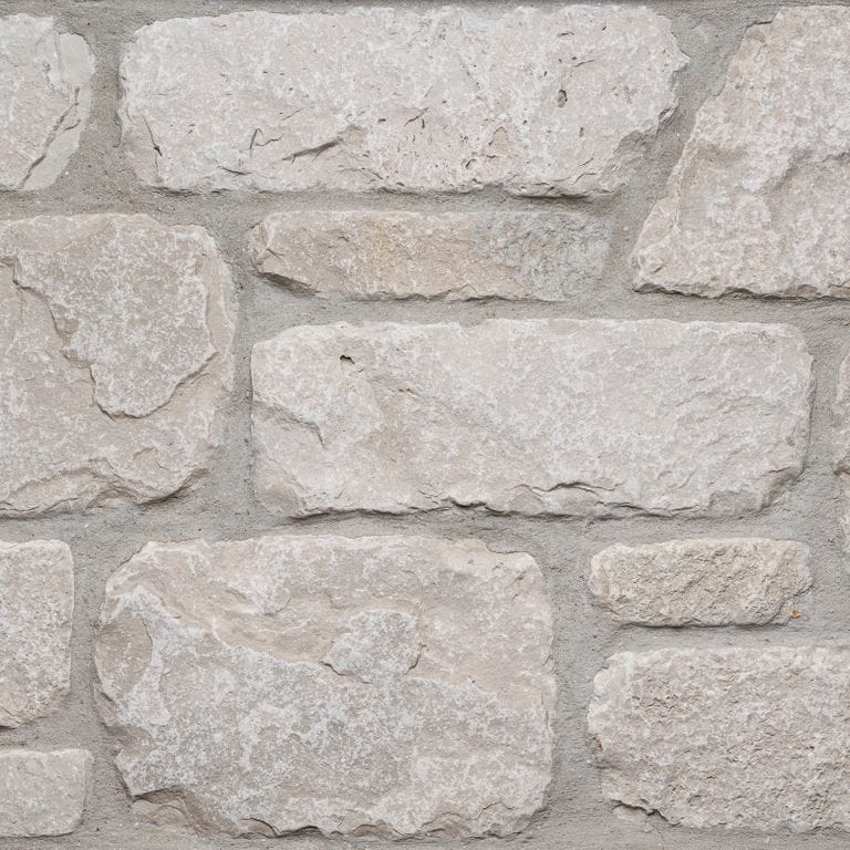 Color/Finish variation image for Fond du Lac Colonial Limestone - Thin Veneer. The surface finish shown is tumbled. The dominant color shown is gray. The color mix creates a warm feeling.