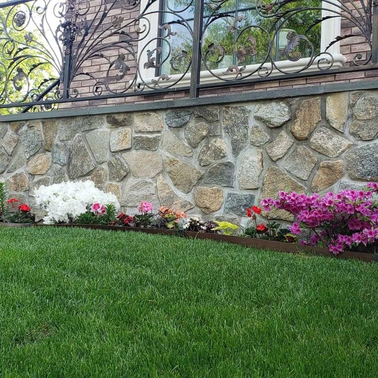 Application image for Boston Blend Granite Veneer - Mosaic. The image shows this product being used in a thin veneer application. The surface finish shown is . The dominant color shown is gray. The color mix creates a warm feeling.