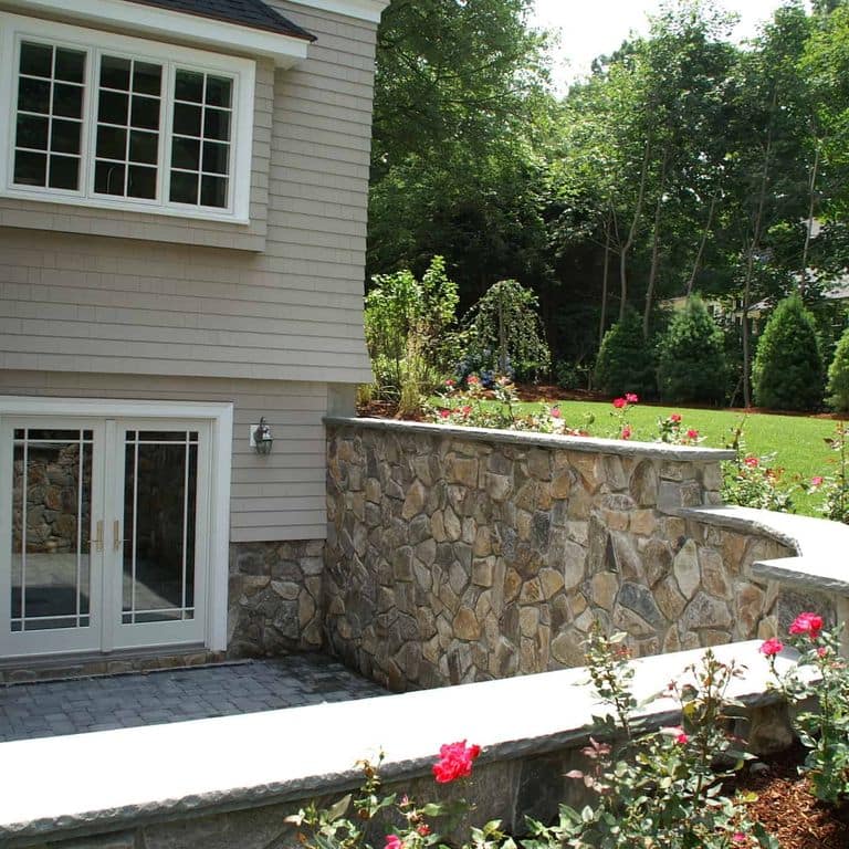 Application image for Boston Blend Granite Veneer - Mosaic. The image shows this product being used in a thin veneer application. The surface finish shown is . Dominant colors shown are gray and tan. The color mix creates a warm feeling.