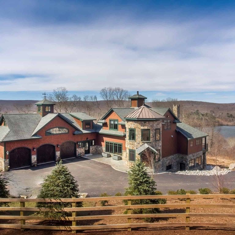 Application image for Boston Blend Granite Veneer - Mosaic. The image shows this product being used in a full bed veneer application. The surface finish shown is . Dominant colors shown are gray and tan. The color mix creates a warm feeling.