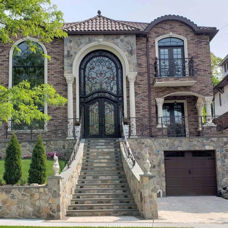 Application image for Boston Blend Granite Veneer - Mosaic. The image shows this product being used in a full bed veneer application. The surface finish shown is . Dominant colors shown are gray and tan. The color mix creates a warm feeling.