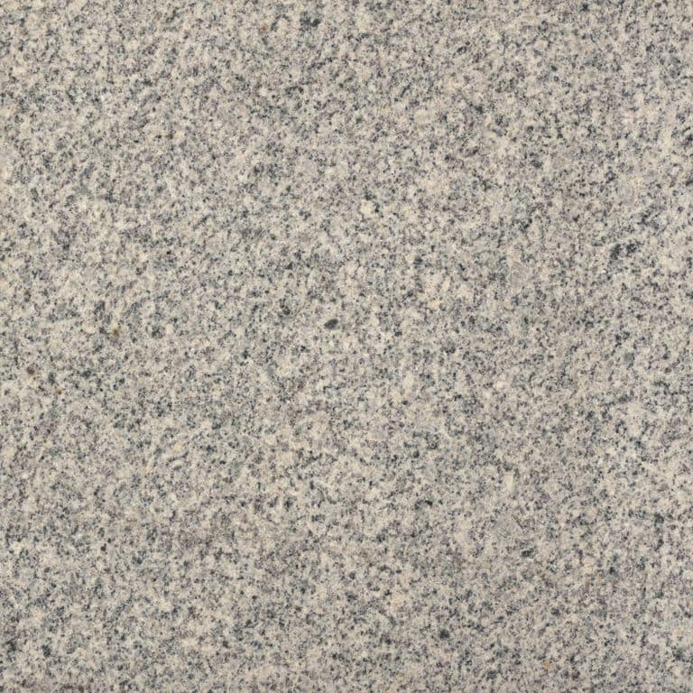 Color/Finish variation image for Cape Neddick Clear Granite - Wallstone. Dominant colors shown are beige and gray; with tan and cream secondaries. The color mix creates a warm feeling. Speckled color pattern.