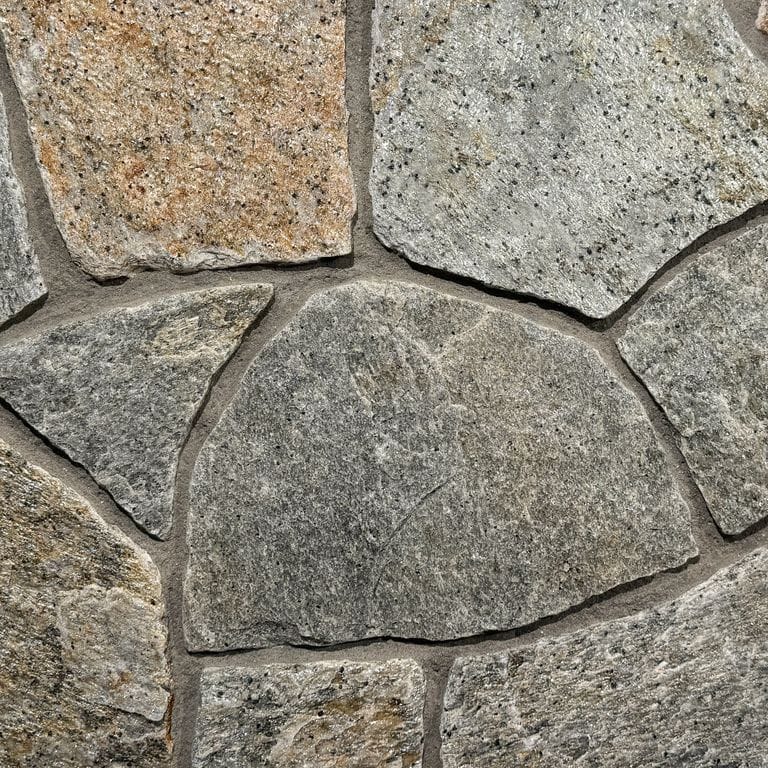 Color/Finish variation image for Newport Mist Granite - Thin Veneer. The surface finish shown is . Dominant colors shown are gray and tan. The color mix creates a warm feeling.