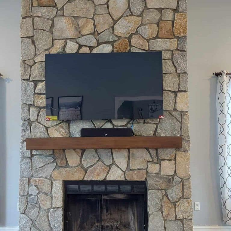 Application image for Newport Mist Granite Veneer - Mosaic. The image shows this product being used in a thin veneer application. The surface finish shown is . Dominant colors shown are brown, gray and tan. The color mix creates a warm feeling.