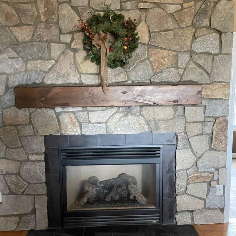 Application image for Newport Mist Granite Veneer - Mosaic. The image shows this product being used for fireplace surround and thin veneer. The surface finish shown is . Dominant colors shown are brown and gray. The color mix creates a warm feeling.
