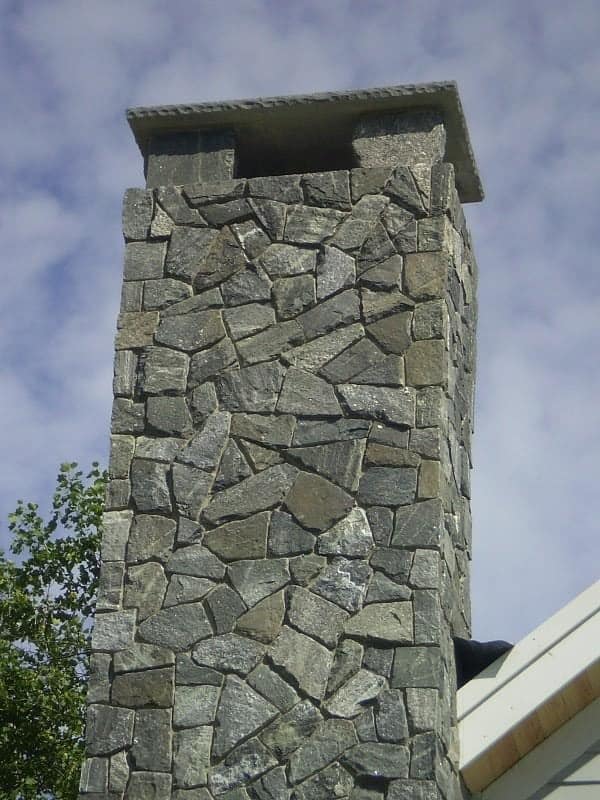 Application image for Greenwich Gray Granite Veneer - Mosaic. The image shows this product being used in a full bed veneer application. The surface finish shown is . The dominant color shown is gray. The color mix creates a cool feeling.