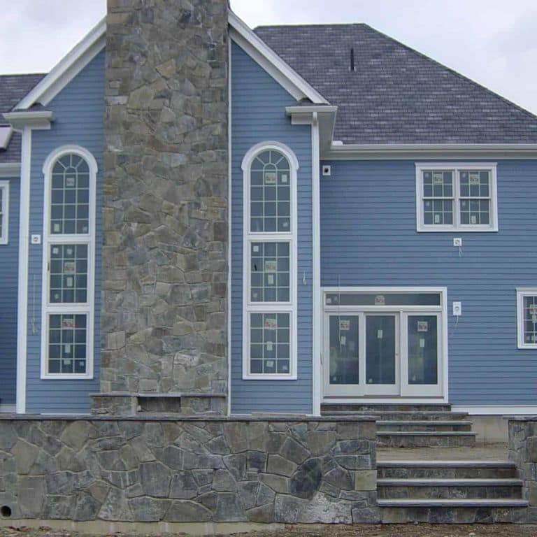 Application image for Greenwich Gray Granite Veneer - Mosaic. The image shows this product being used in a full bed veneer application. The surface finish shown is . The dominant color shown is gray. The color mix creates a cool feeling.