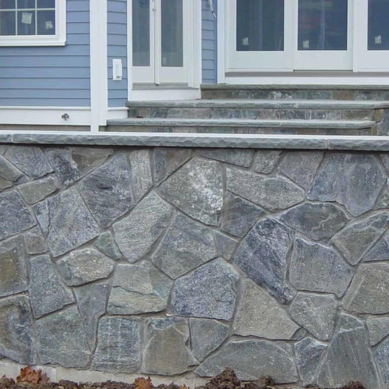 Application image for Greenwich Gray Granite Veneer - Mosaic. The image shows this product being used in a thin veneer application. The surface finish shown is . The dominant color shown is gray.