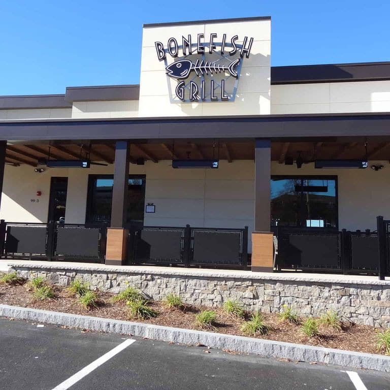 Application image for New England Tan Granite Veneer - Ashlar. The image shows this product being used in a thin veneer application. The surface finish shown is split-face. Dominant colors shown are gray and tan. The color mix creates a warm feeling.