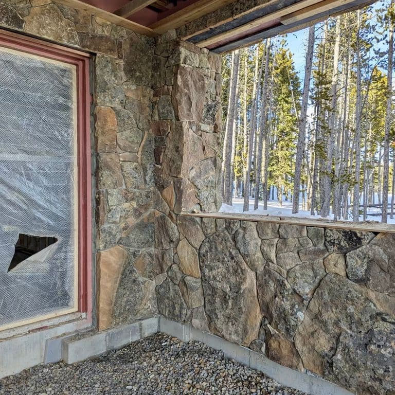 Application image for Montana Moss Rock - Veneer. The image shows this product being used in a full bed veneer application. Dominant colors shown are brown and gray. The color mix creates a warm feeling.