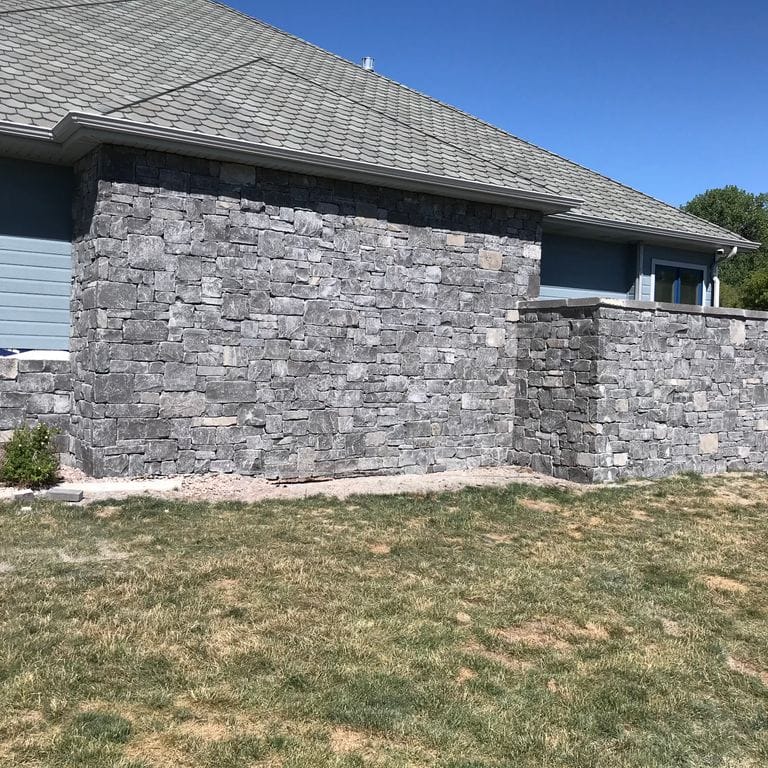 Application image for Mountain Storm Limestone - Veneer. The image shows this product being used for full bed veneer and thin veneer. The dominant color shown is gray.