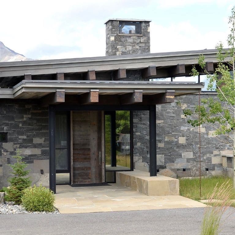 Application image for Mountain Storm Limestone - Veneer. The image shows this product being used in a full bed veneer application. The dominant color shown is gray.