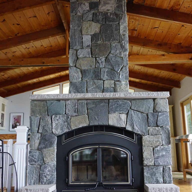 Application image for Greenwich Gray Granite Veneer - Square and Rectangle. The image shows this product being used in a full bed veneer application. The surface finish shown is . The dominant color shown is brown. The color mix creates a cool feeling.