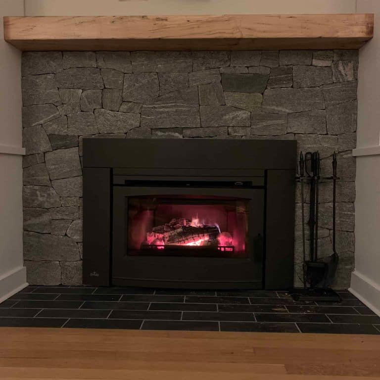 Application image for Oyster Bay Granite Thin Veneer - Ashlar. The image shows this product being used in a thin veneer application. The surface finish shown is split-face. The dominant color shown is gray. The color mix creates a cool feeling.