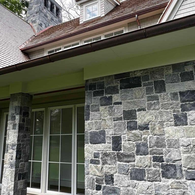 Application image for Oyster Bay Granite Thin Veneer - Square and Rectangle. The image shows this product being used in a thin veneer application. The surface finish shown is . The dominant color shown is gray. The color mix creates a cool feeling.