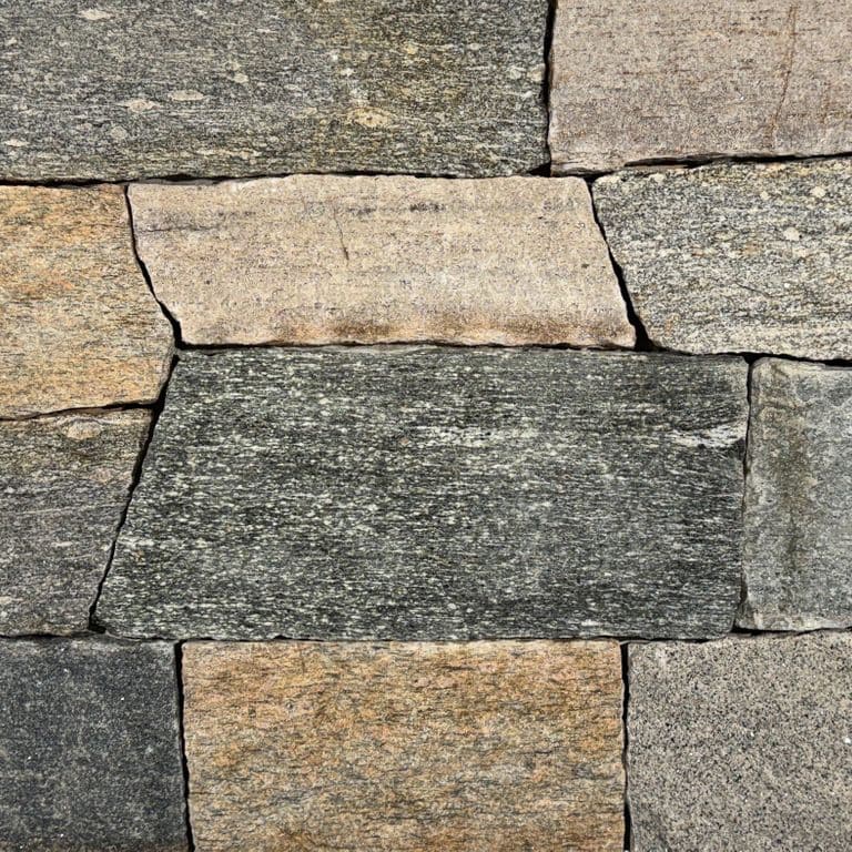 Color/Finish variation image for Boston Blend Granite Thin Veneer - Ashlar. The surface finish shown is split-face. Dominant colors shown are black, gray and tan.