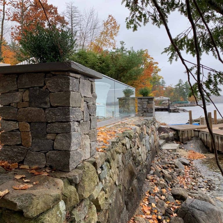 Application image for Boston Blend Granite Thin Veneer - Ashlar. The image shows this product being used in a thin veneer application. The surface finish shown is split-face. Dominant colors shown are gray and tan. The color mix creates a warm feeling.