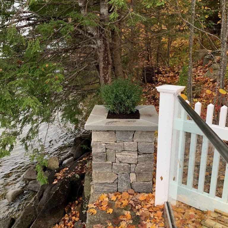 Application image for Boston Blend Granite Thin Veneer - Ashlar. The image shows this product being used in a full bed veneer application. The surface finish shown is split-face. The dominant color shown is gray. The color mix creates a warm feeling.