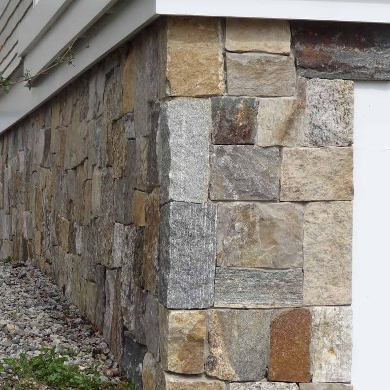 Best close-up image for Boston Blend Granite Veneer - Square and Rectangles. The image shows this product being used in a full bed veneer application. The surface finish shown is . Dominant colors shown are brown and gray. The color mix creates a warm feeling.