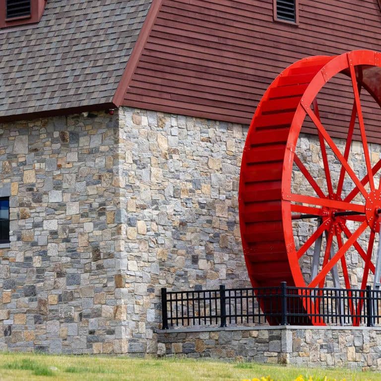 Application image for Boston Blend Granite Veneer - Square and Rectangles. The image shows this product being used in a full bed veneer application. The surface finish shown is . Dominant colors shown are gray and tan. The color mix creates a warm feeling.