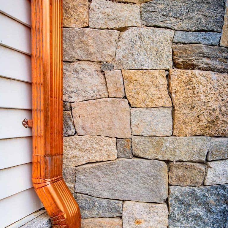 Application image for Boston Blend Granite Veneer - Square and Rectangles. The image shows this product being used in a thin veneer application. The surface finish shown is . Dominant colors shown are gray and tan. The color mix creates a warm feeling.