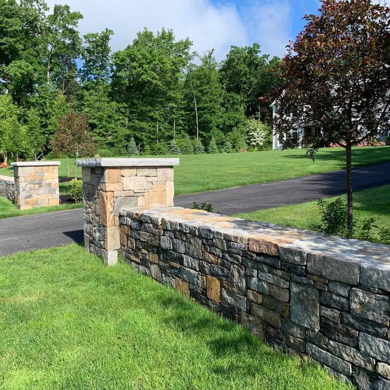 Application image for Boston Blend Granite Veneer - Square and Rectangles. The image shows this product being used in a thin veneer application. The surface finish shown is . Dominant colors shown are gray and tan. The color mix creates a warm feeling.