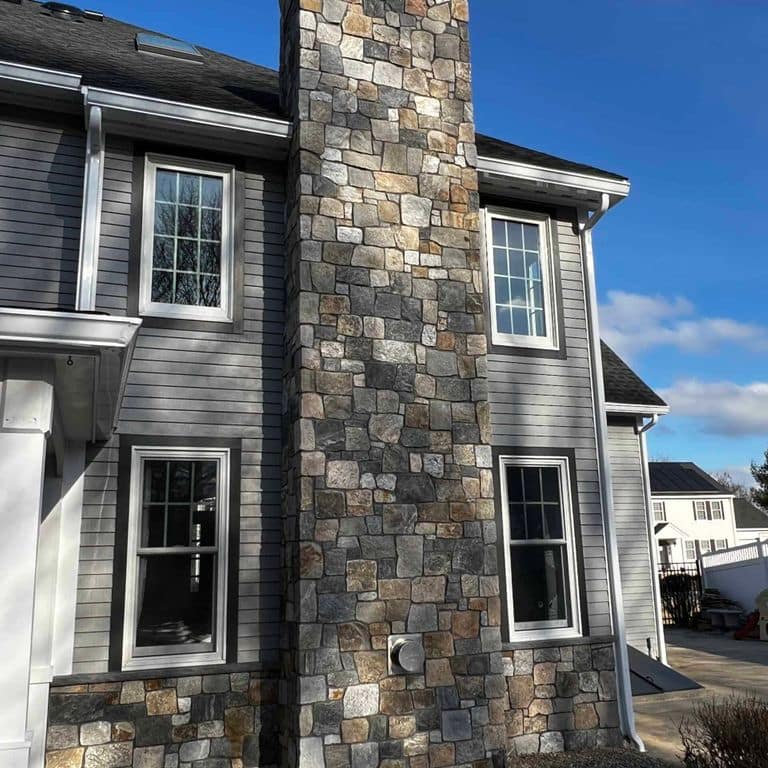 Application image for Boston Blend Granite Veneer - Square and Rectangles. The image shows this product being used in a full bed veneer application. The surface finish shown is . Dominant colors shown are gray and tan. The color mix creates a warm feeling.