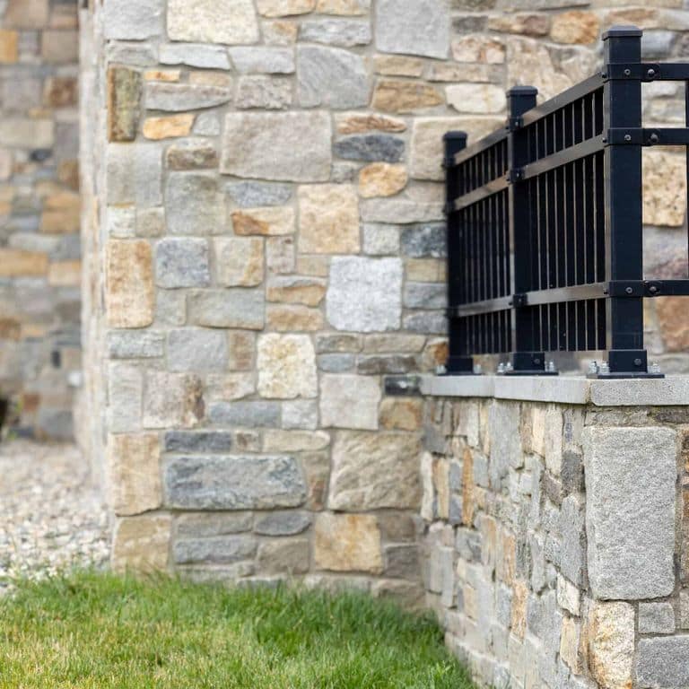 Application image for Boston Blend Granite Veneer - Square and Rectangles. The image shows this product being used in a full bed veneer application. The surface finish shown is . The dominant color shown is gray. The color mix creates a warm feeling.