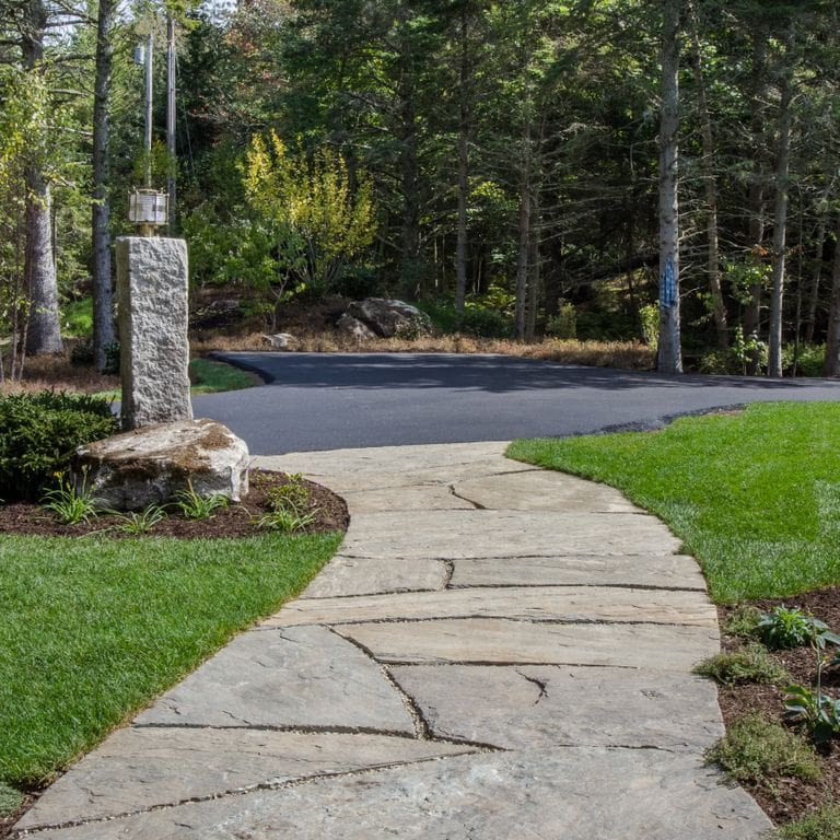 The image shows this product being used in a path pavers application.