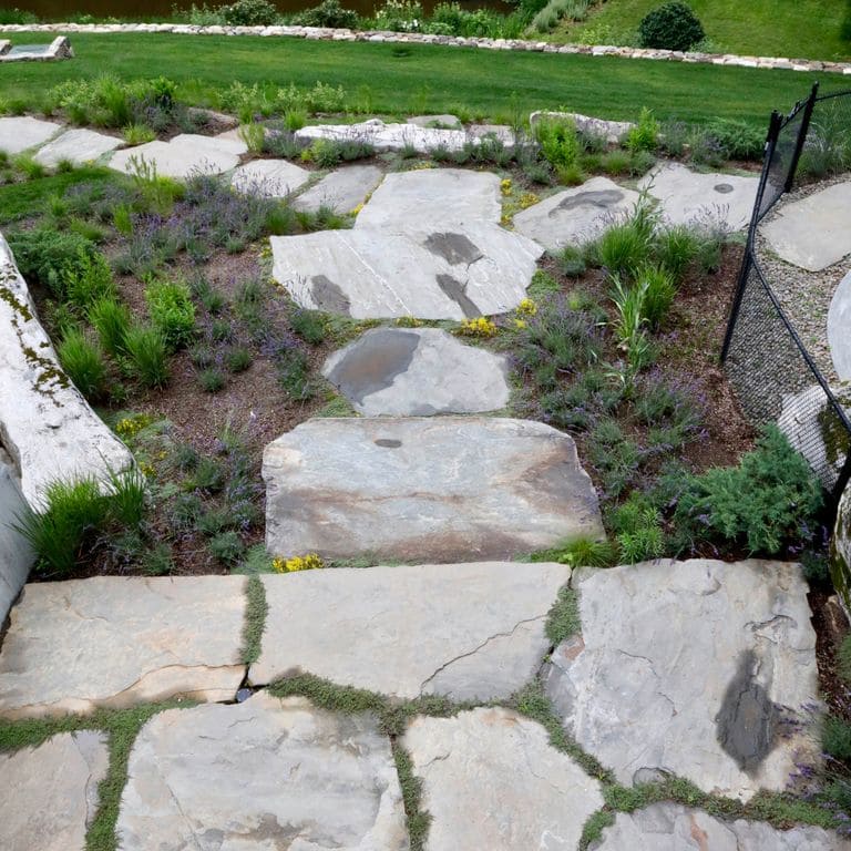 The image shows this product being used for Granite- Mystic Mountain- Natural - Oversized Pavers.