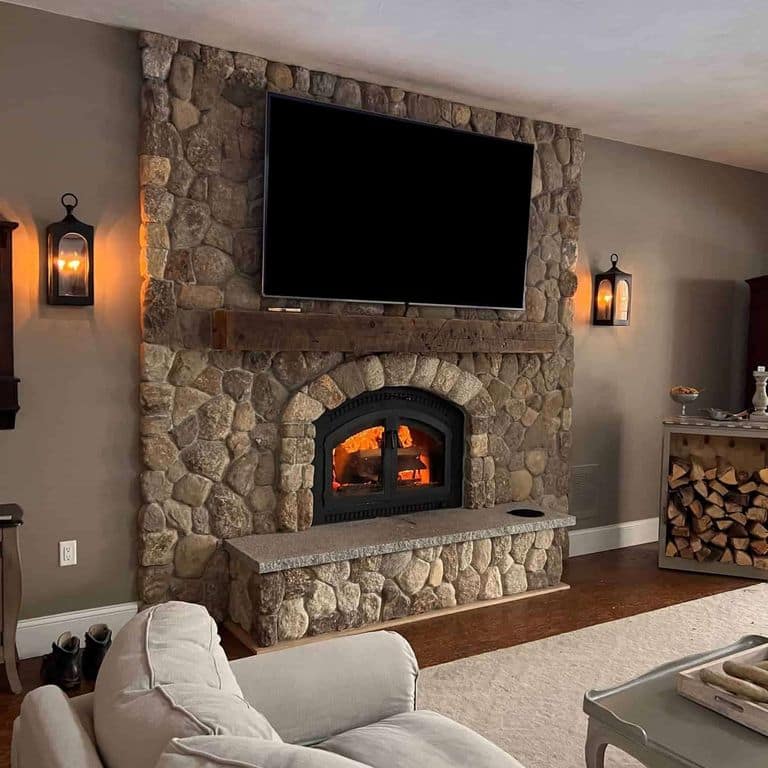 Application image for Boston Blend Granite Veneer - Rounds. The image shows this product being used for fireplace surround and thin veneer. The surface finish shown is . The dominant color shown is brown. The color mix creates a warm feeling.