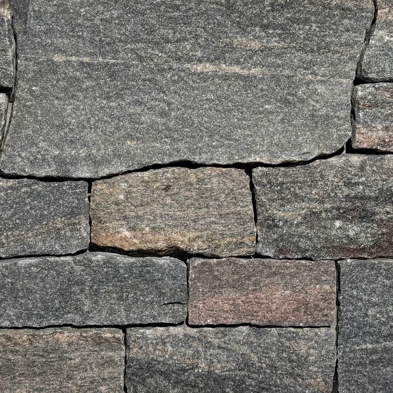 Color/Finish variation image for Vineyard Granite Veneer - Ashlar. The surface finish shown is split-face. The dominant color shown is gray. The color mix creates a warm feeling.