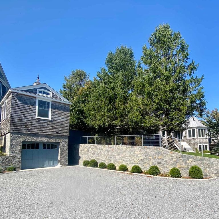 Application image for Vineyard Granite Veneer - Ashlar. The image shows this product being used in a thin veneer application. The surface finish shown is split-face. Dominant colors shown are gray and tan. The color mix creates a cool feeling.