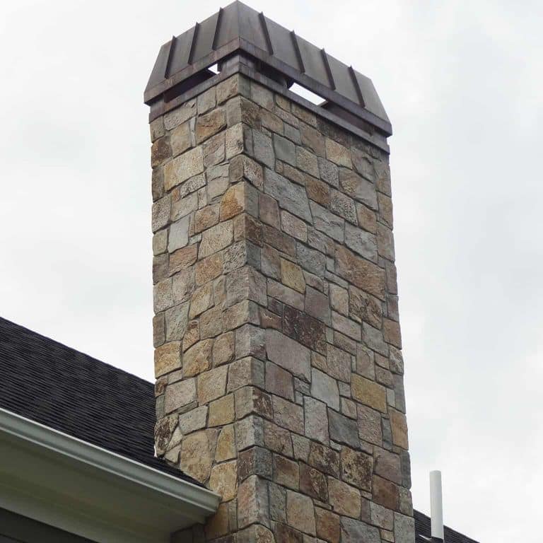 Application image for New England Tan Granite Veneer - Square and Rectangle. The image shows this product being used in a thin veneer application. The surface finish shown is . Dominant colors shown are gray and tan. The color mix creates a warm feeling.