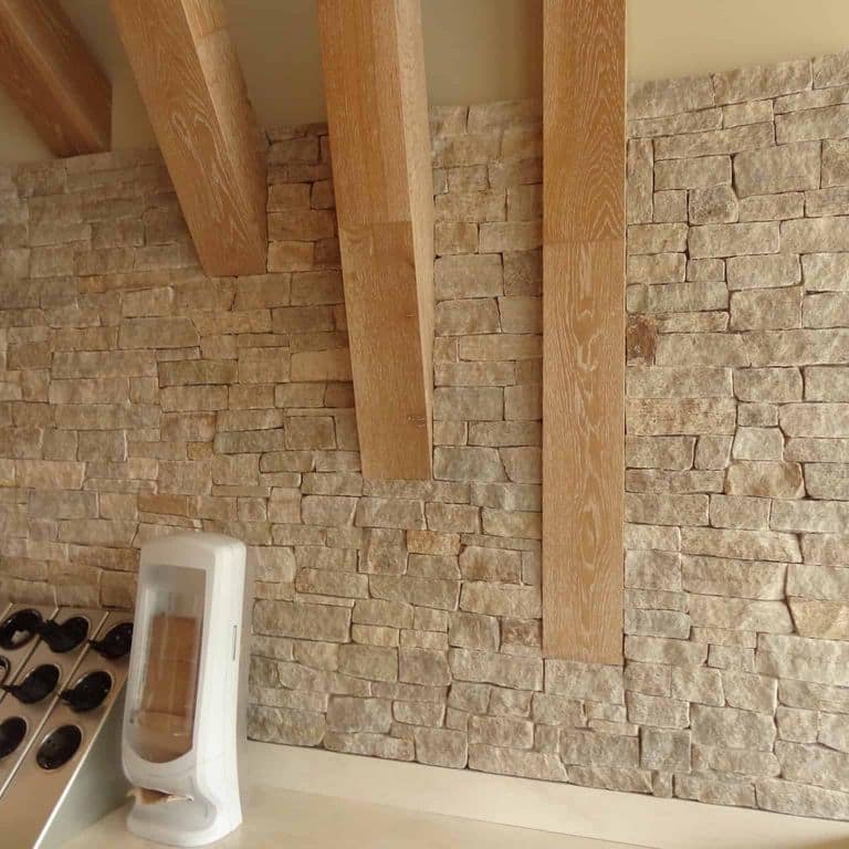 Application image for New England Tan Granite Veneer - Ledge. The image shows this product being used in a thin veneer application. The surface finish shown is split-face. Dominant colors shown are brown and tan. The color mix creates a warm feeling.