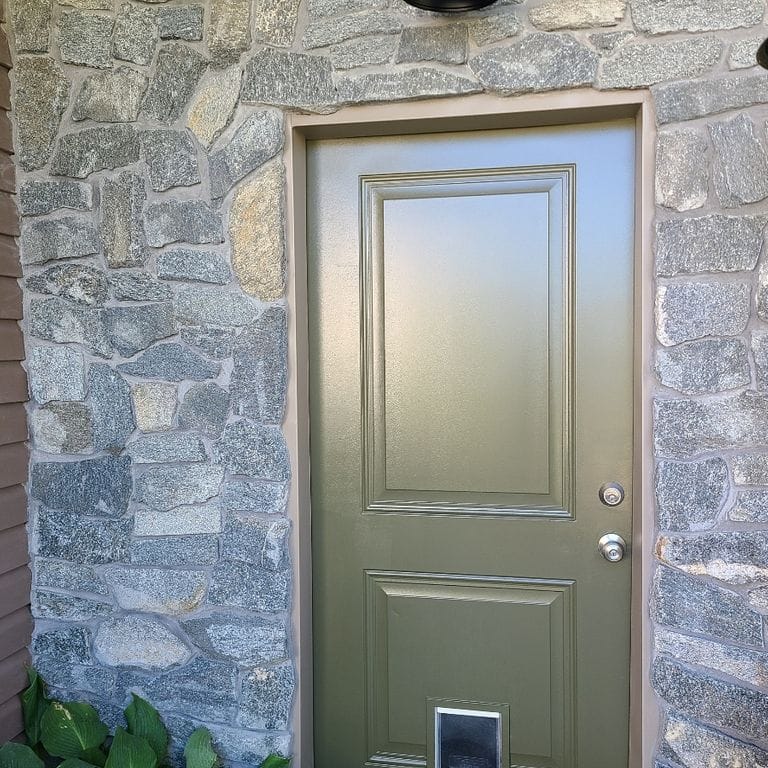 Application image for Rocky Mountain Granite - Veneer. The image shows this product being used in a full bed veneer application. The surface finish shown is split-face. The dominant color shown is gray. The color mix creates a cool feeling.