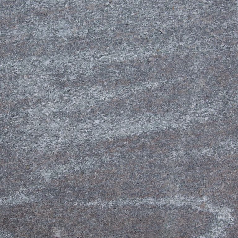 Color/Finish variation image for Granite - Mystic Mountain- Dimensional Cut Pavers. Dominant colors shown are blue and gray; with green and purple secondaries. Exhibits "movement" and the color mix creates a cool feeling. Random, fine speckled and streaked color patterns.