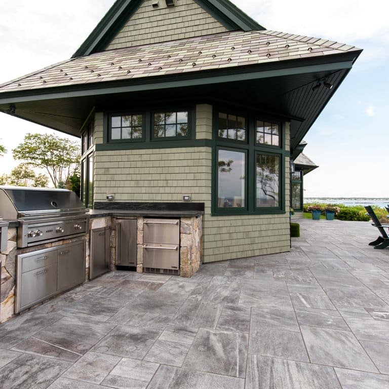The image shows this product being used in a patio pavers application.