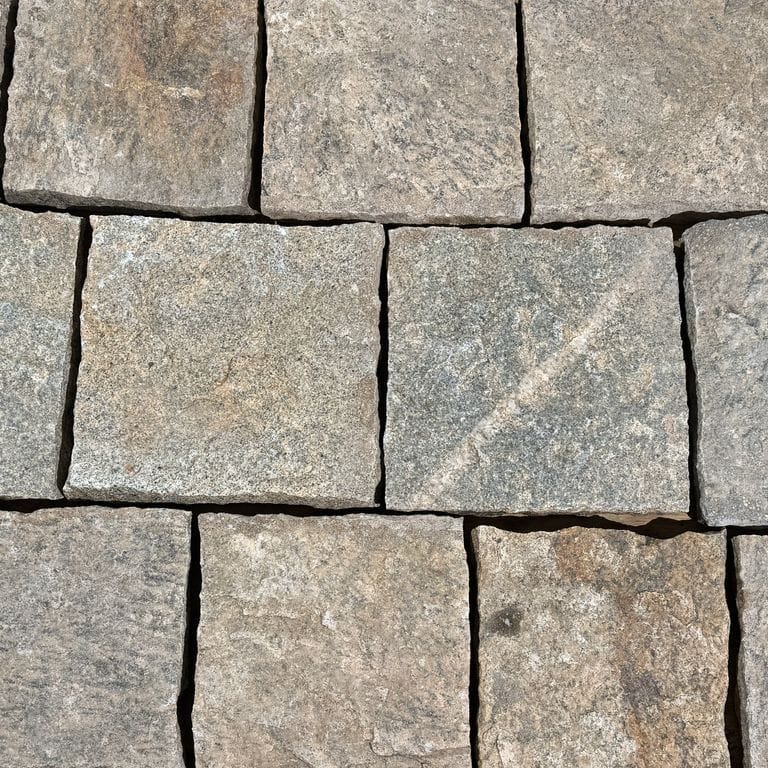 Color/Finish variation image for Reclaimed Rustic Granite - Cobblestone Pavers. The surface finish shown is . The dominant color shown is gray. The color mix creates a warm feeling.