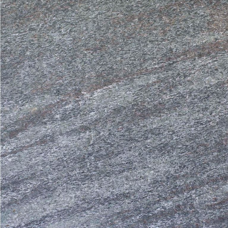 Swatch image cropped for Mystic Mountain Cut to Fit Pavers. The surface finishes shown are flamed and sawn. Dominant colors shown are blue and gray; with green, purple and white secondaries. Exhibits "movement" and the color mix creates a cool feeling. Speckled and streaked color patterns.
